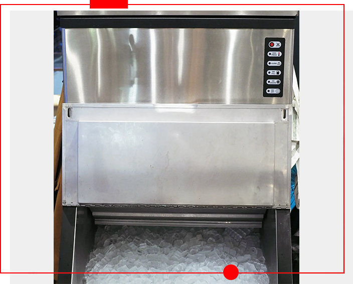 A stainless steel ice machine with four keys.